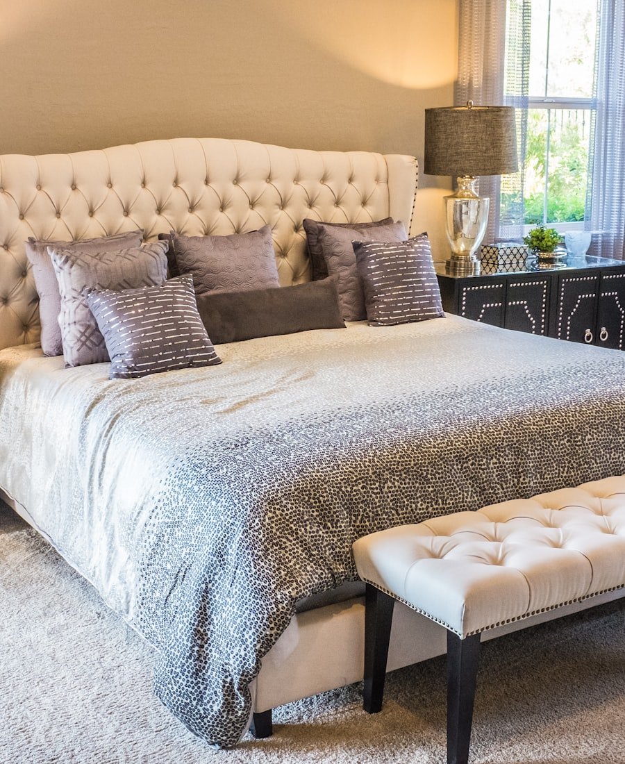 Serene bedroom with soft white bedding and morning light