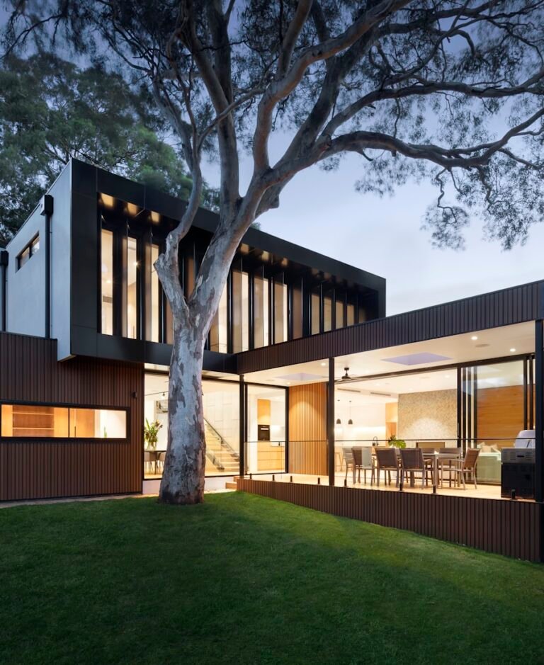 Beautiful home exterior with manicured landscaping at dusk