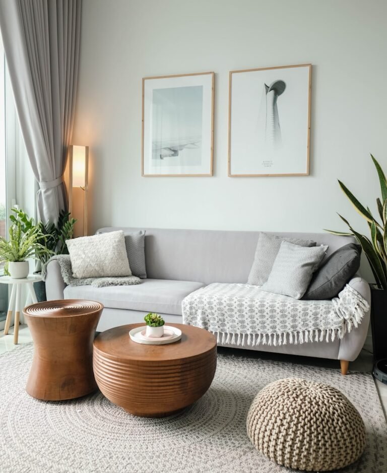 Mid-century modern interior with dark accent wall and sculptural furniture