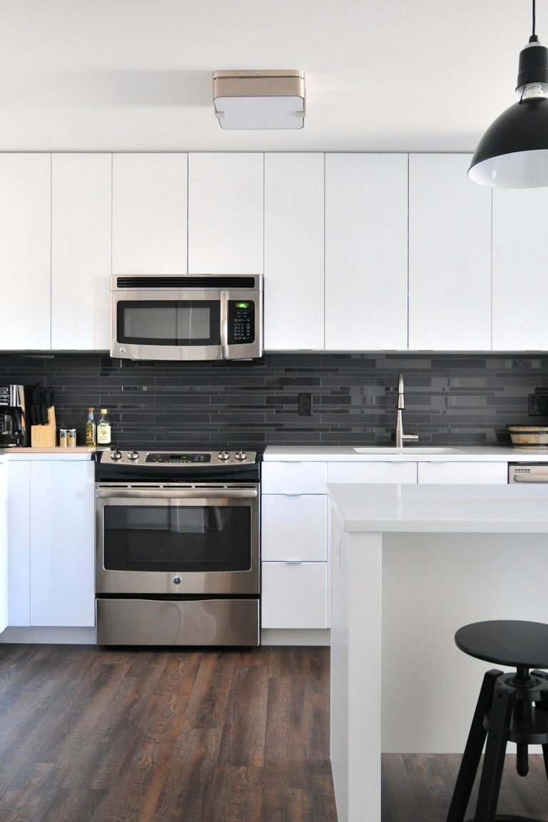 Modern farmhouse kitchen and dining space with warm neutral palette